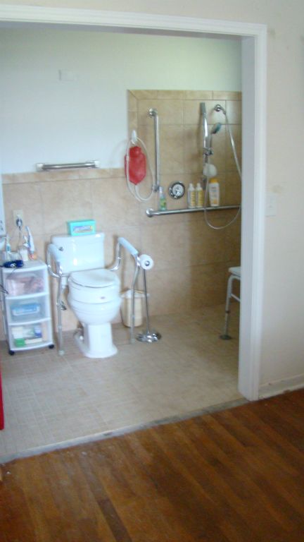 The existing small bathroom is now wheelchair friendly and very accessible